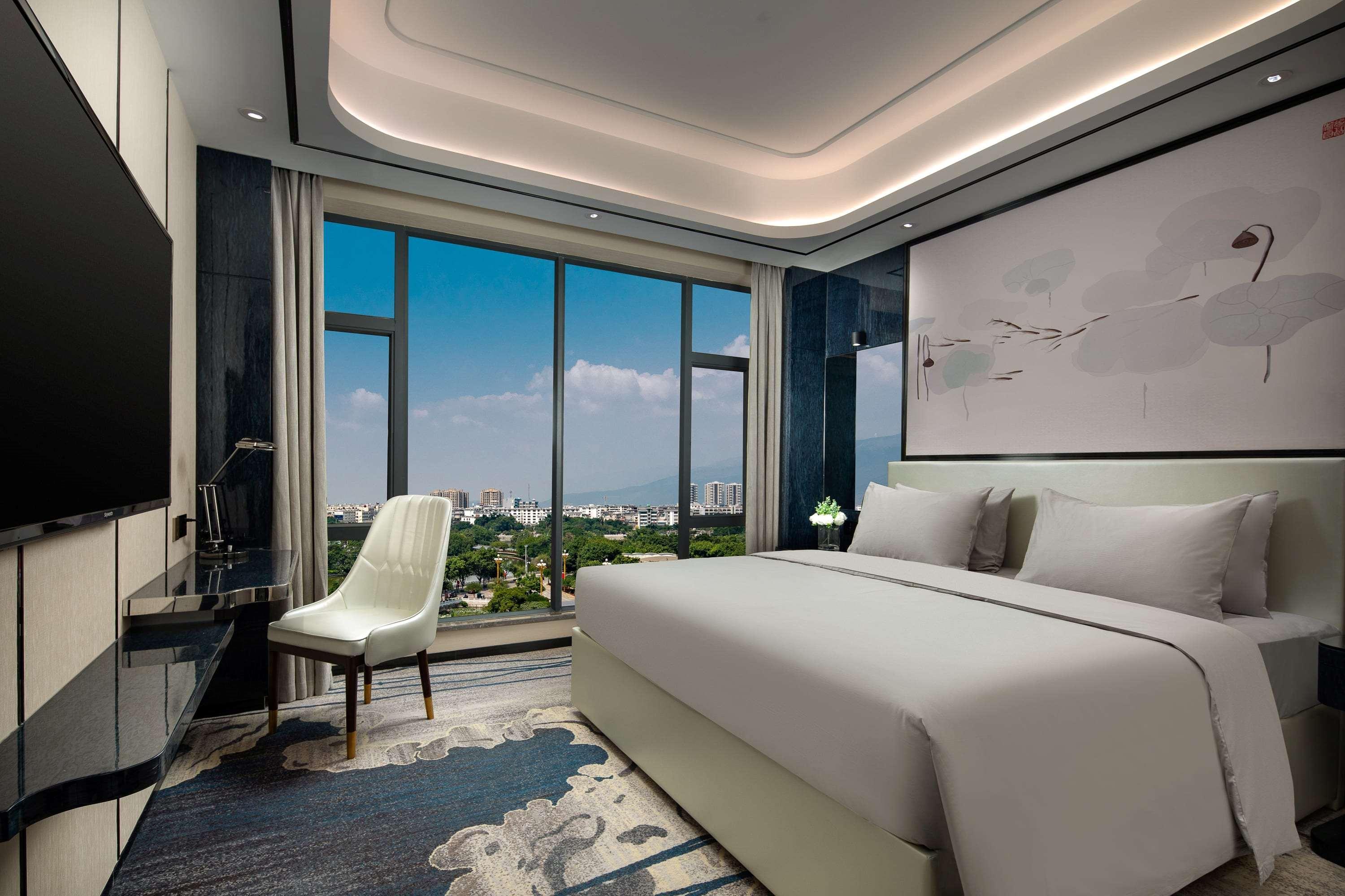 Ramada By Wyndham Mengzi Suites Экстерьер фото